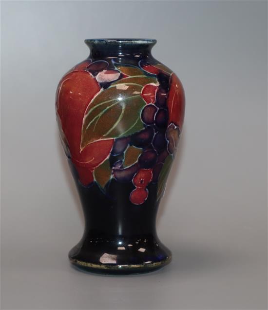 A Moorcroft miniature pomegranate baluster vase